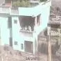 Nepal Floods: House Stands Amid Raging Waters and Debris, Three People Survive on Balcony